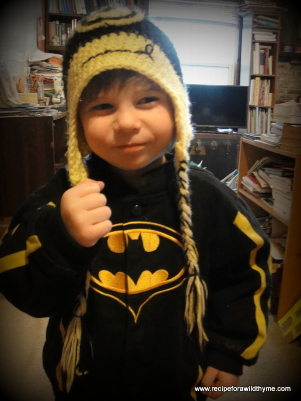 Me: "Why are you holding your fist up?" Seth: "I'm Batman getting ready to punch somebody."  Yep...that cute face with the Minion hat is SO intimidating! LOL!